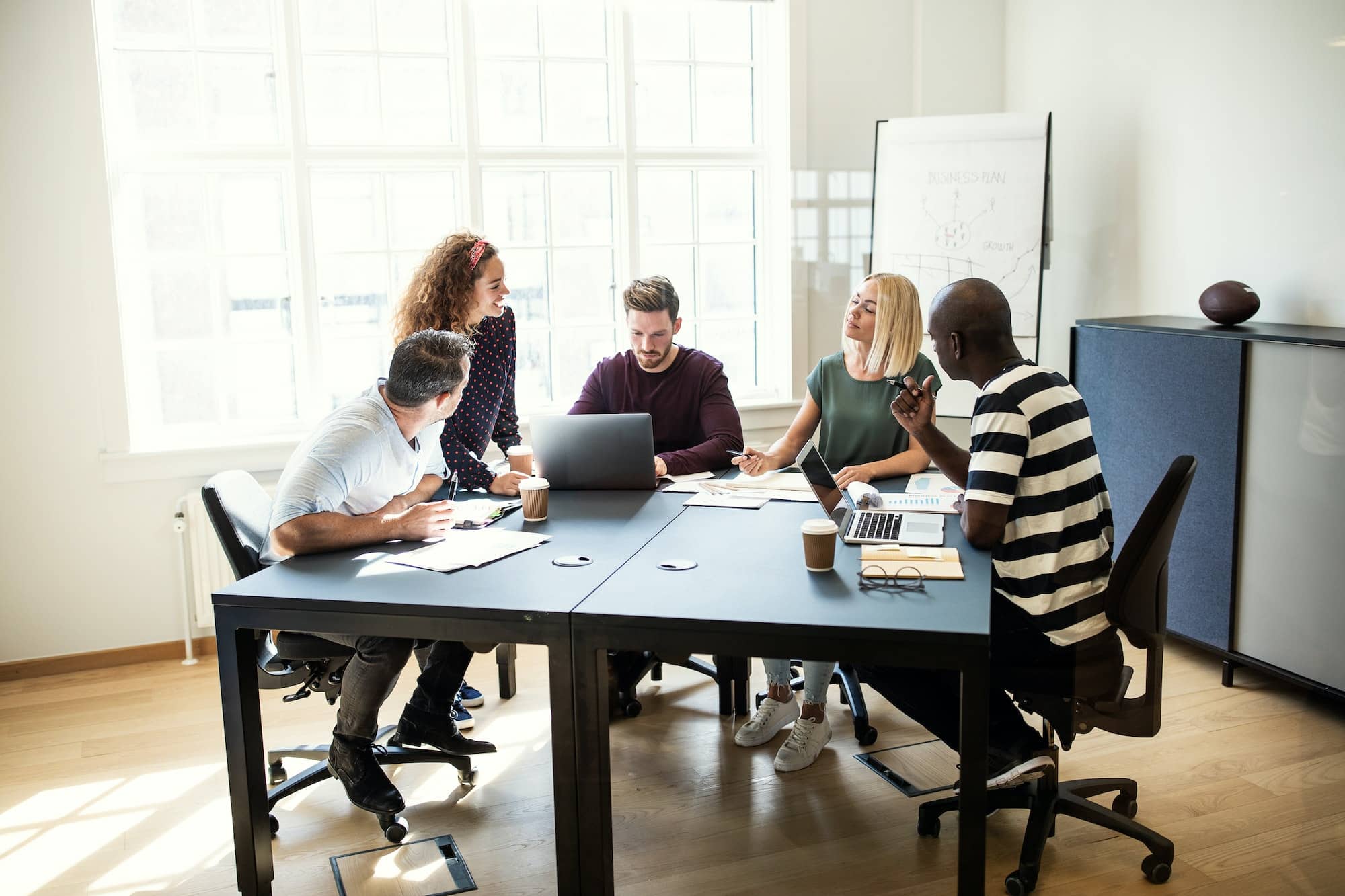 Designers working on a project together in an office